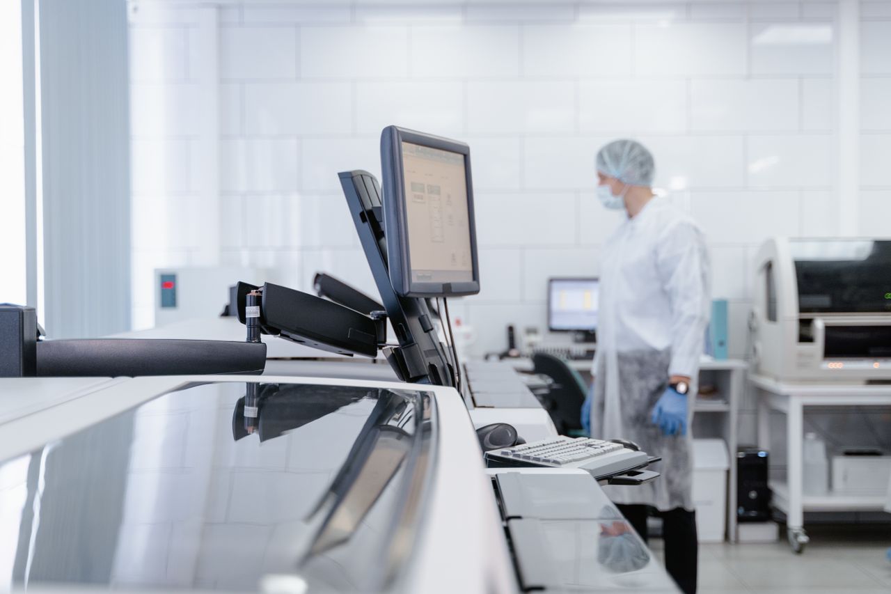 The Art of Drawing Readers In: Your attractive post title goes here Lab technician working in a modern research facility, focusing on technology and healthcare.